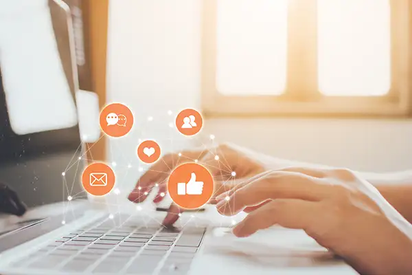 Hands using laptop with icon social media and social network Hands using laptop with icon social media and social network